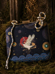 TABU Wearing Midnight Crane Clutch