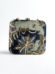 MISHA MOMIN Wearing Night Safari Clutch