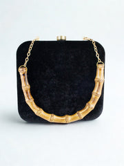 MISHA MOMIN Wearing Night Safari Clutch