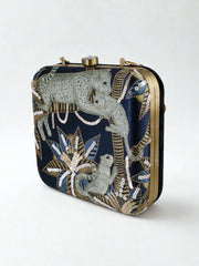 MISHA MOMIN Wearing Night Safari Clutch