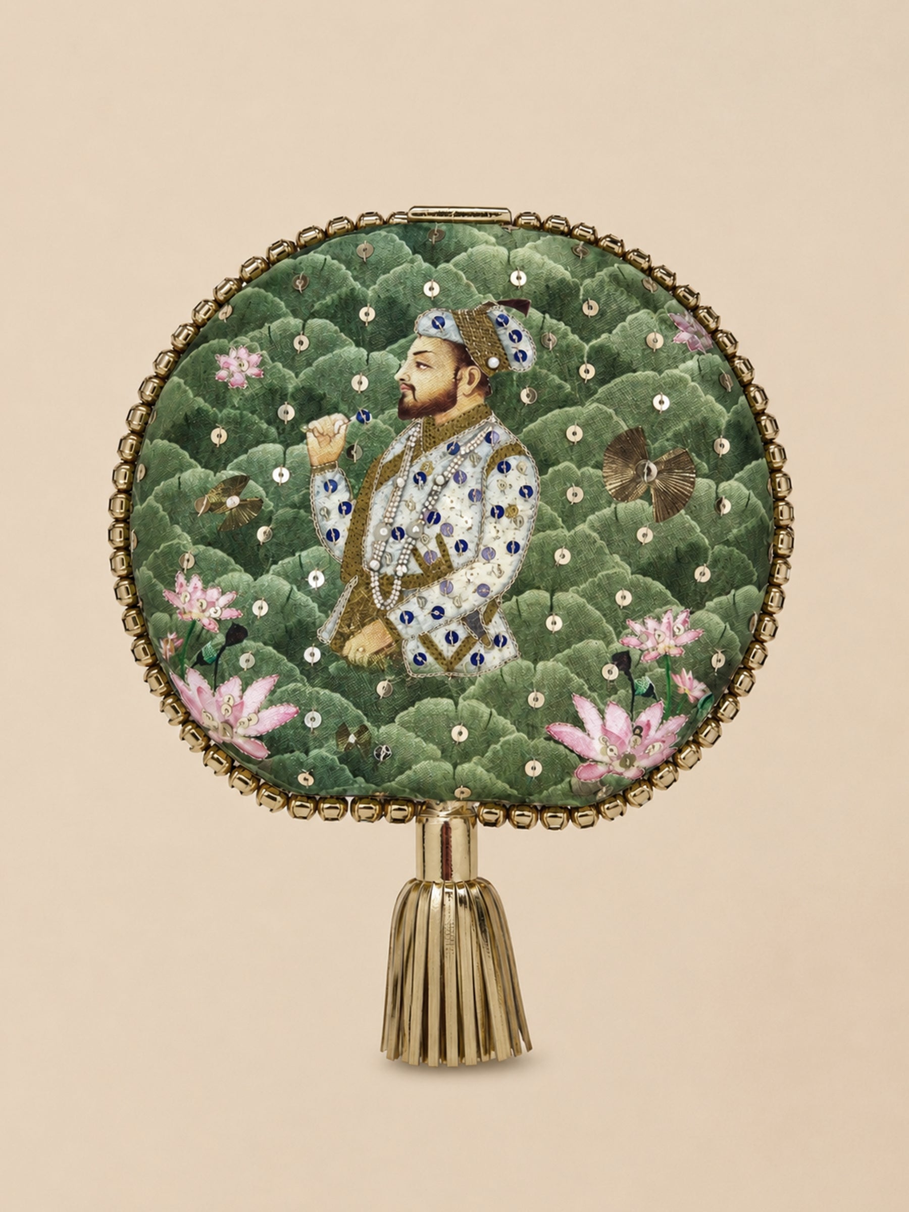 Mughal E Taj Embroidered Clutch, a round clutch in green scalloped fabric with a Mughal-style miniature portrait of a nobleman among lotus flowers, gold sequins, and a beaded border with gold tassel.
