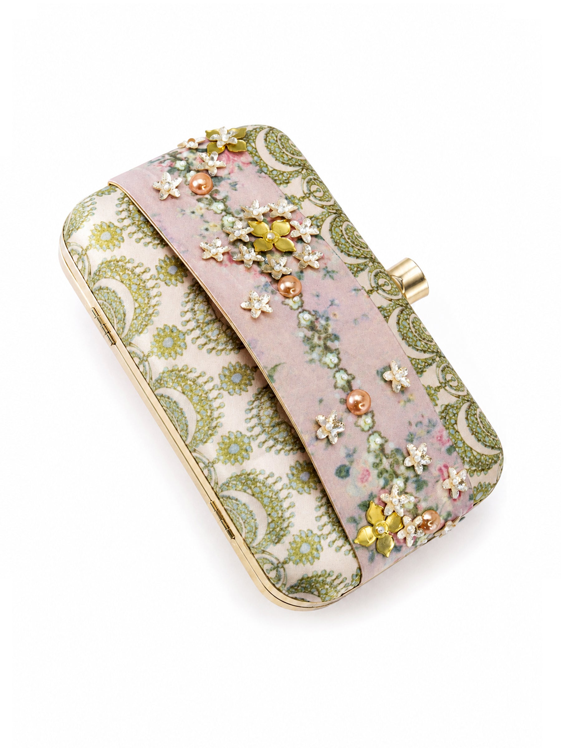 Angled top-down view of the Garden of Jewels Clasp Clutch showing the green paisley-patterned fabric, pink floral center band with pearl and crystal flower embellishments, and gold frame with clasp.