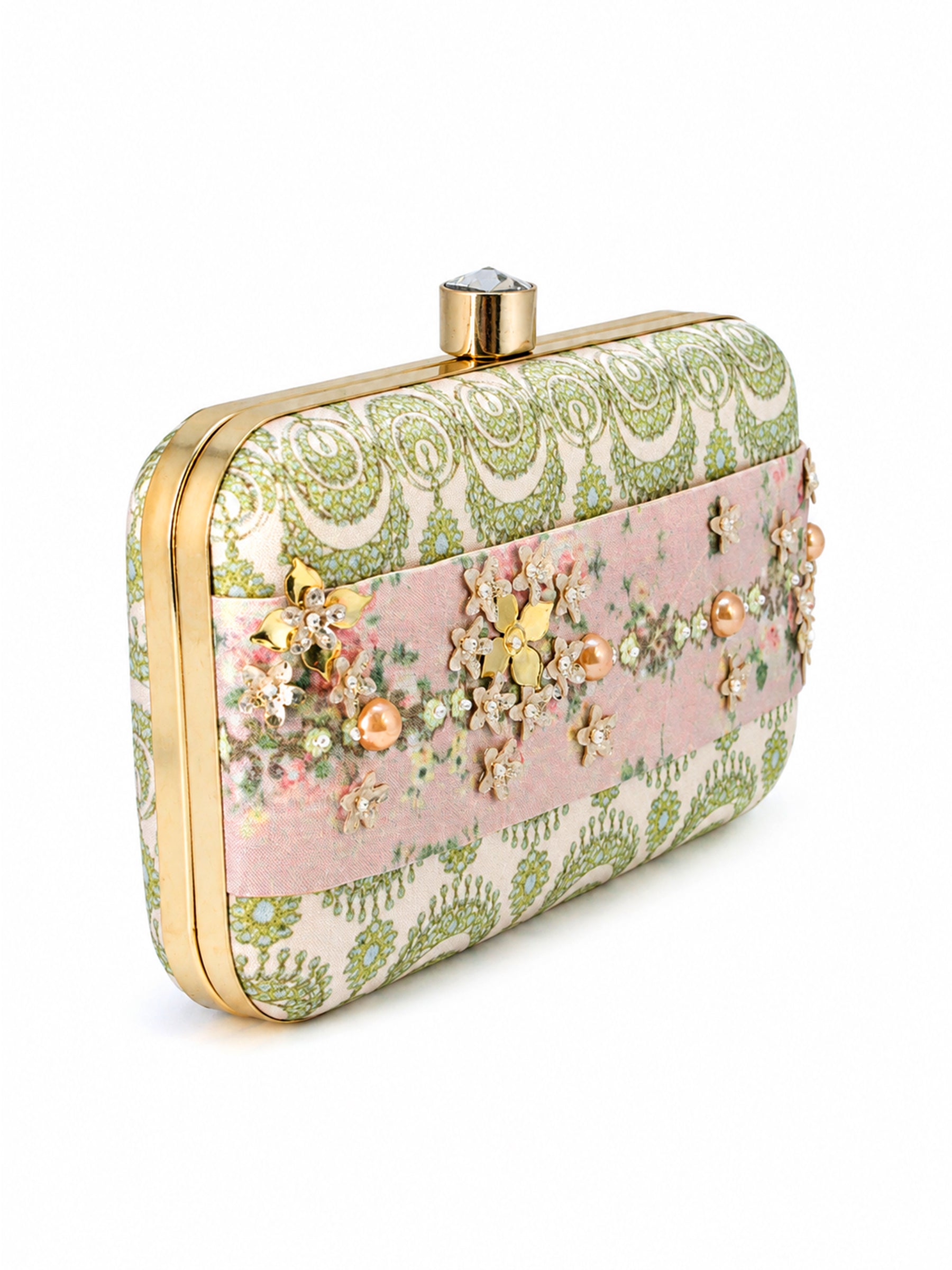 Side angled view of the Garden of Jewels Clasp Clutch showing the gold hinge and frame, green paisley-patterned fabric, and pink floral center band with pearl and crystal flower embellishments.