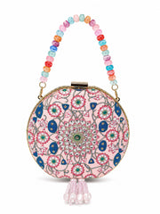 Kamal Bagh Embroidered Clutch, round pink clutch with lotus mandala embroidery and a multicolor beaded top handle, front view on white background