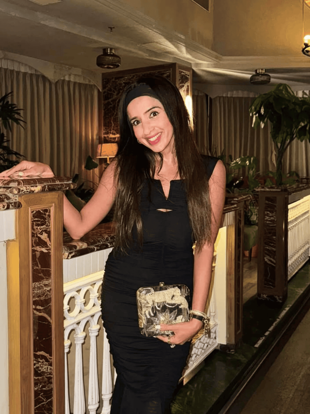 MISHA MOMIN Wearing Night Safari Clutch