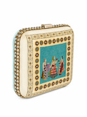 Angled view of the Saheliya Embroidered Clutch highlighting the row of clear crystal gemstones set along the side edge.