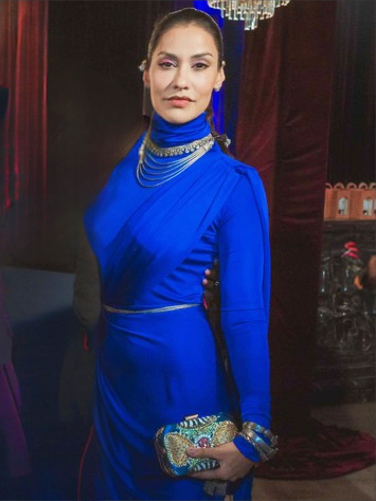 JANINA GAVANKAR | American Actress Wearing Ultramarine Royale Clutch Bag